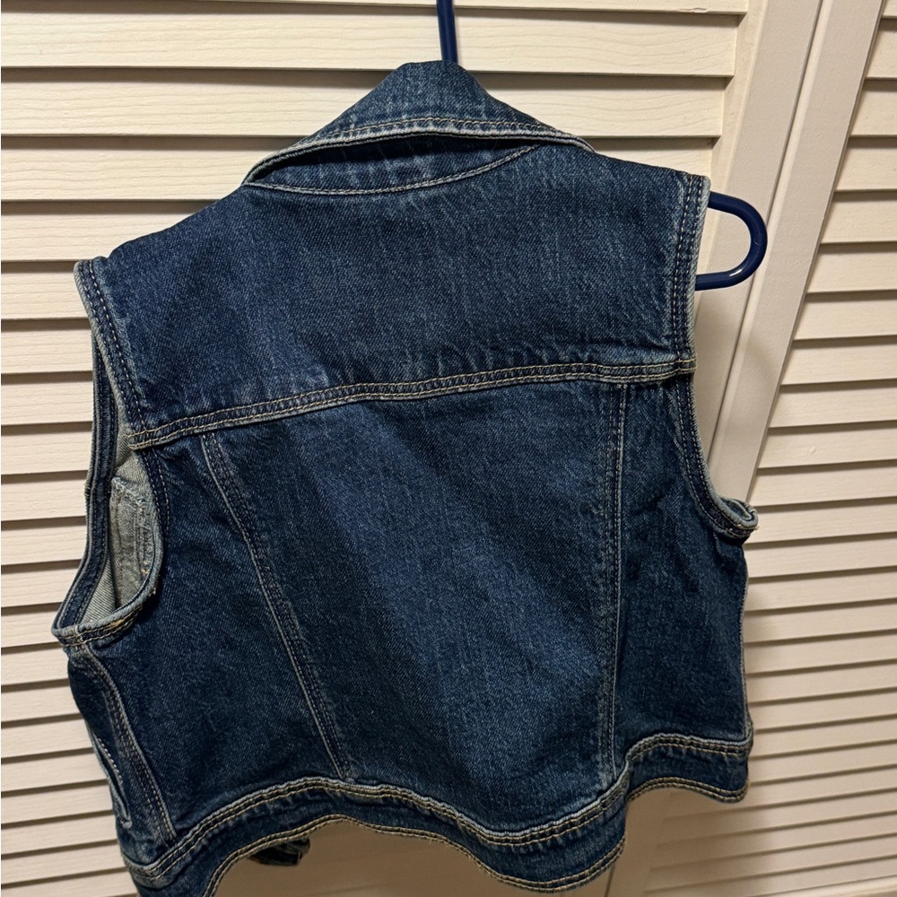Jean jacket vest for young boy. Very cool.